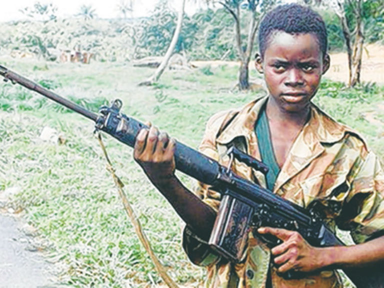 Child soldier with gun
