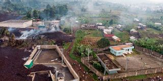 Debris engulfs buildings in Bushara village