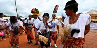 Women dance in Mama village