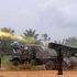 Congolese troops throw a missile during a fight against rebels of ADF-Nalu.