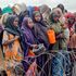 Internally-displaced Somalis wait for food at a distribution point in Mogadishu.