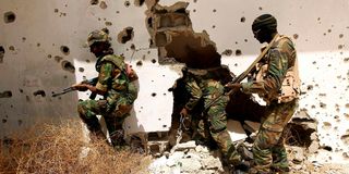 Libyan pro-government forces patrol