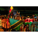 An Nyege Nyege festival-goer waves the Kenyan flag