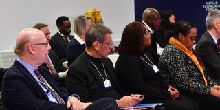 Delegates listen as President Samia Suluhu Hassan speaks