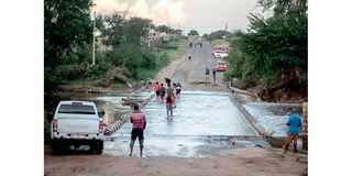 people crossing a bridge in sa