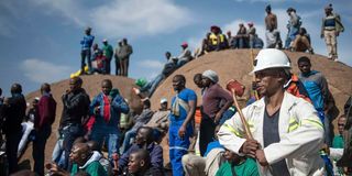 Miners gather during commemorations to mark the fourth anniversary of the Marikana Massacre in Rustenburg