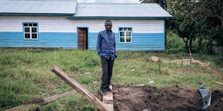 A man stands next to a hole in Kishishe