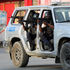 Police officers take part in a confrontation with gangs near the National Palace, in Port-au-Prince, Haiti March 21, 2024.
