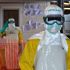 Health workers wearing protective gear at an Ebola treatment centre.