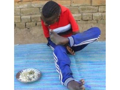 Student who writes with his feet scores Division One with five points